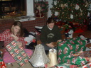 Childeren opening christmas gifts.